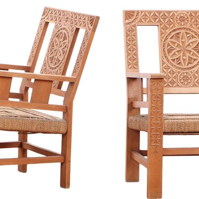 Sale Photo Thumbnail #287: A PAIR OF FRENCH HEAVILY CARVED ARM CHAIRS HAVING RUSH SEATS IN THE MOORISH TASTE CIRCA 1960.