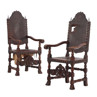 Sale Photo Thumbnail #230: OVERSIZED PAIR OF NINETEENTH C CARVED WALNUT, LEATHER AND BRASS STUDS OPEN ARM CHAIRS.