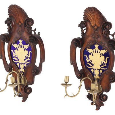 Sale Photo Thumbnail #207: A PAIR OF NINETEENTH CENTURY  WALNUT WALL SCONCES HAVING HERALDIC DECORATED GLASS PANELS WITH