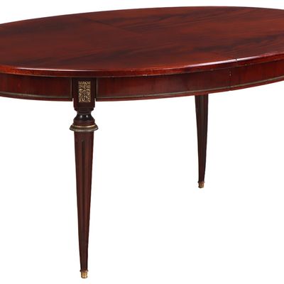 Sale Photo Thumbnail #228: A FRENCH CROTCH MAHOGANY OVAL BRONZE MOUNTED LOUIS XVI STYLE DINING ROOM TABLE HAVING TWO MAHOGANY