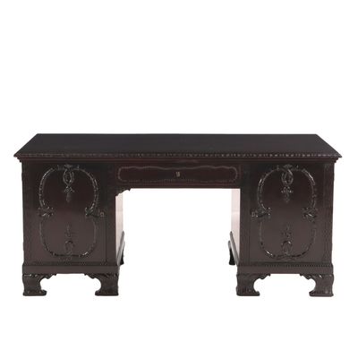 Sale Photo Thumbnail #261: CHIPPENDALE STYLE MAHOGANY FLAT TOP DESK HAVING TWO DOORS OPENING TO SHELVES AND A DRAWER C 1910.