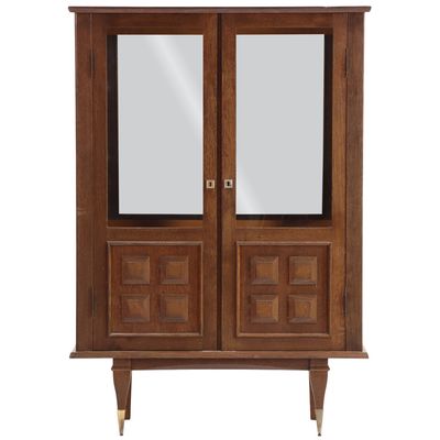 Sale Photo Thumbnail #286: FRENCH OAK TWO DOOR CABINET HAVING MIRRORED BACK AND GEOMETRIC MOTIF C 1950.