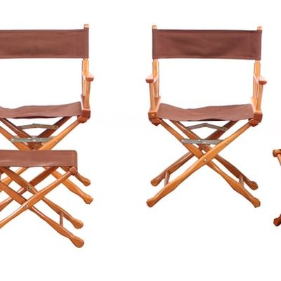 FOUR CAMPAIGN STYLE FOLDING CHAIRS ALONG WITH TWO MATCHING STOOLS.