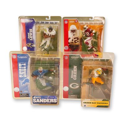 A Group of Four McFarlane Toys NFL Sportspicks Action Figures in Boxes