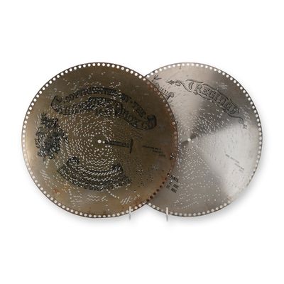 Regina 15.5-Inch Perforated Metal Music Box Discs, c. 1897