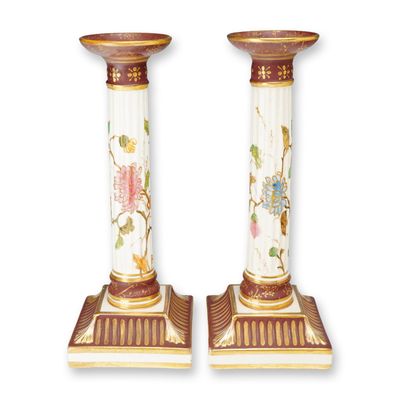 A Pair of Wedgwood Porcelain Columnar Candlesticks with Raised Gold Enhancements