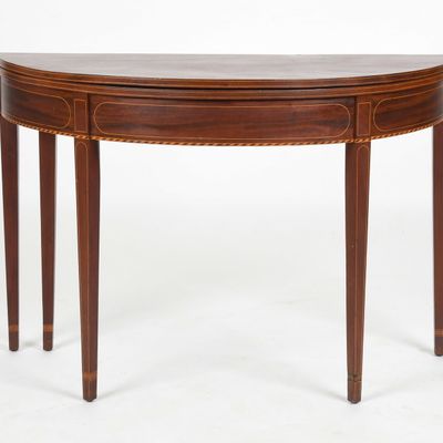 Sale Photo Thumbnail #116: A Federal String-Inlaid Mahogany Demilune Games Table, Late 18th/ Early 19th Century