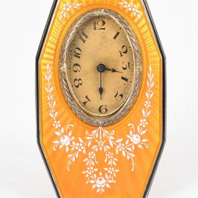 Sale Photo Thumbnail #445: A Circa 1920 Desk or Travel Clock with Yellow Guilloche Case