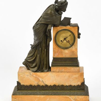 Sale Photo Thumbnail #349: A Louis Philippe Patinated-Bronze and Sienna Marble Figural Mantel Clock, c. 1830-1840