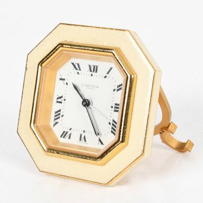 Sale Photo Thumbnail #423: A Cartier Brass and Enamel Octagonal Desk Clock, Late 20th Century