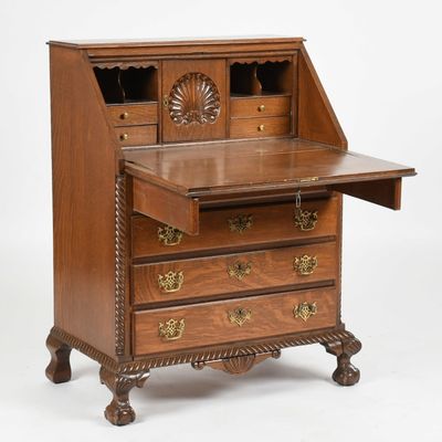 Sale Photo Thumbnail #118: A Chippendale-Style Oak Slant-Front Desk, 20th Century