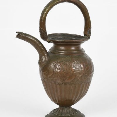 Sale Photo Thumbnail #352: A Repousse Copper Wine Ewer