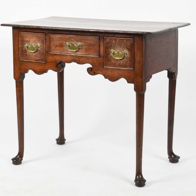 Sale Photo Thumbnail #321: A Queen Anne Oak Dressing Table, Mid 18th Century