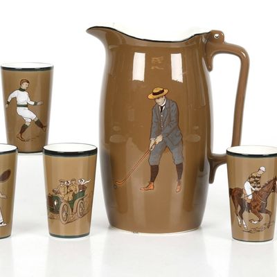 Sale Photo Thumbnail #144: A Villeroy and Boch Pitcher and Cup Set, Sports Themed