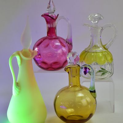 ASSORTMENT OF FOUR GLASS CRUETS