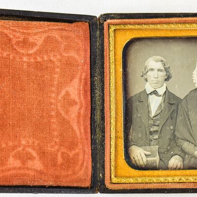 DAGUERREOTYPE OF A LITERATE COUPLE WITH THEIR BOOKS