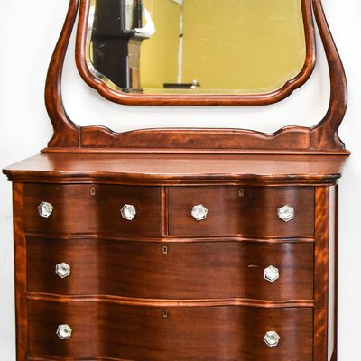 LATE VICTORIAN MAHOGANY SERPENTINE DRESSER