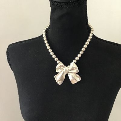 Cute Vintage silver tone. Bow necklace