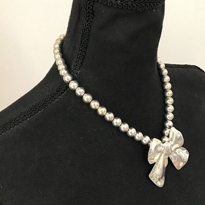 Cute Vintage silver tone. Bow necklace