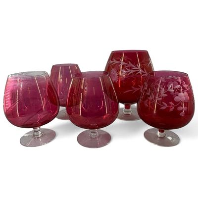 Sale Photo Thumbnail #137: Five Cranberry Glass Stemmed Vessels