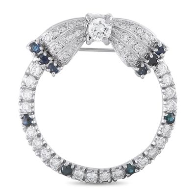 Sale Photo Thumbnail #295: Vintage Platinum 1.50ct Diamond and Sapphire Open Circle Bow Brooch