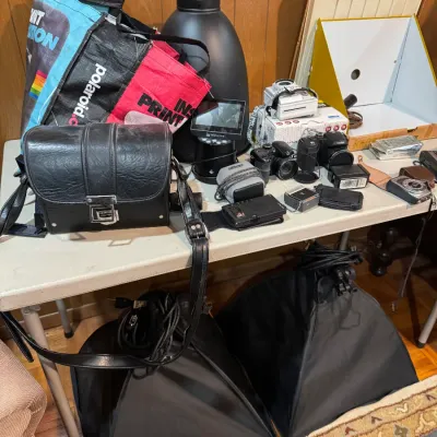Sale Photo Thumbnail #11: assortment of camera equipment by ge koda minolta nikon