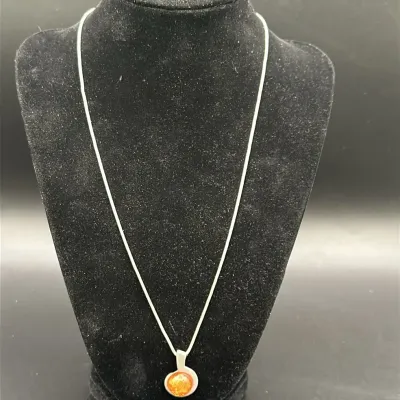 Amber-Tone Swirl Pendant Necklace on a Silver-Tone Snake Chain