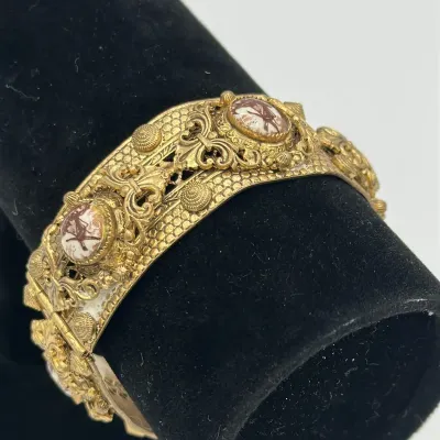 Ornate Gold-Tone Filigree Bracelet with Classical Portrait Panels