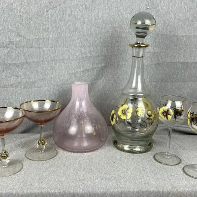Floral Gilt Decanter Set, Pink Spatter Glass Vase, and Gilt Rim Coupes