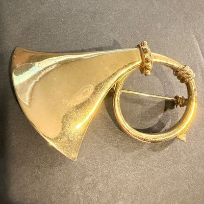 Gold tone vintage instrument brooch