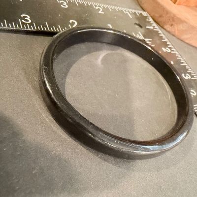 Black bangle with a smooth finish