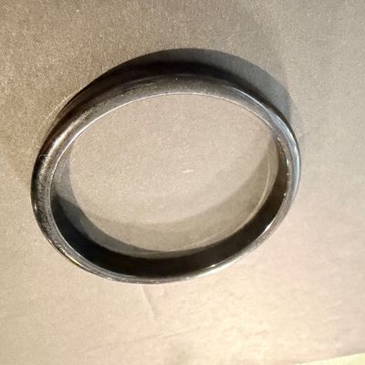Black bangle with a smooth finish