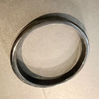Black bangle with a smooth finish