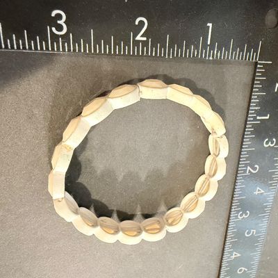 Off white colored stretch fashion bracelet