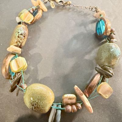 Premier Designs Island Girl Bracelet, featuring a multi-strand design with green and blue ceramic or glass beads and shell accents