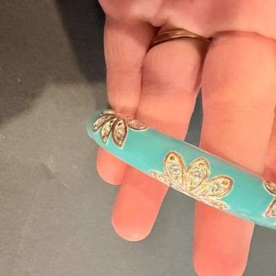 Silver tone rhinestone floral light blue bangle bracelet
