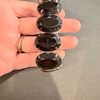 Black gemstone type silver tone stretch bracelet