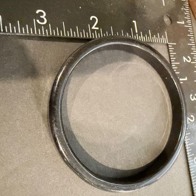 Black bangle with a smooth finish