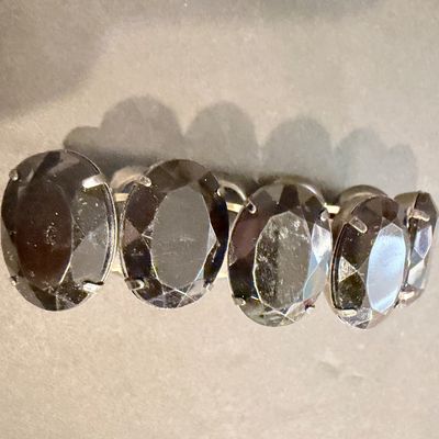 Black gemstone type silver tone stretch bracelet