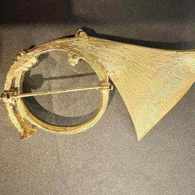 Gold tone vintage instrument brooch