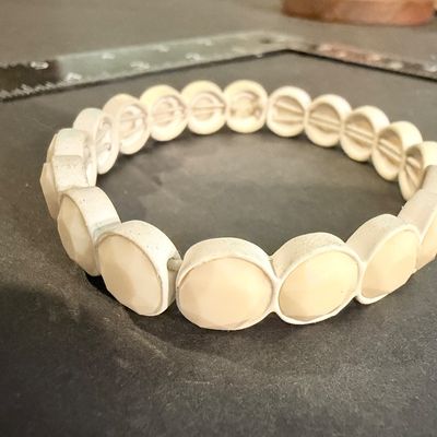 Off white colored stretch fashion bracelet