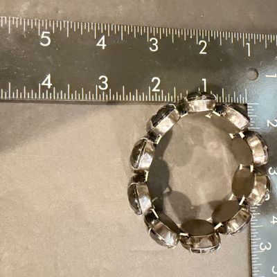 Black gemstone type silver tone stretch bracelet