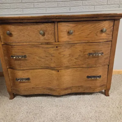 Antique Oak Serpentine-Front 4-Drawer Dresser with Ornate Hardware