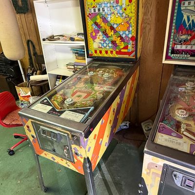 Vintage Williams "Spanish Eyes" pinball machine, released in 1972, featuring a vibrant, psychedelic art style on the backglass...