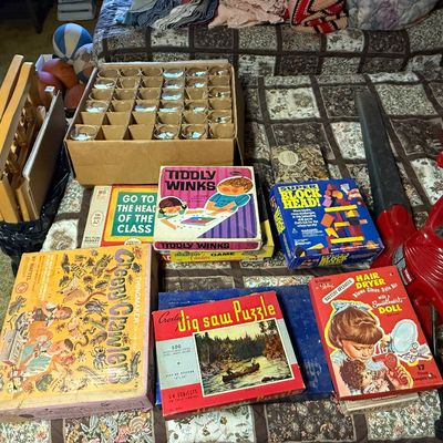 Collection of vintage board games and toys, including Mattel Creepy Crawlers, Tiddly Winks, and a Croxley jigsaw puzzle, alongside a Toro...