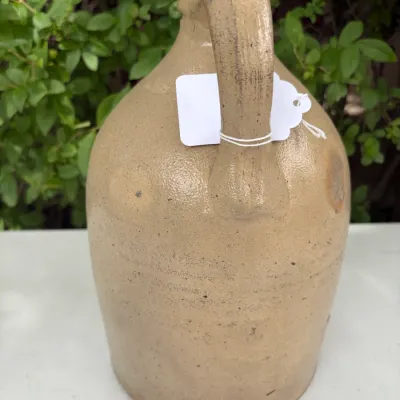 NEW YORK STONEWARE CO., HANDLED JUG WITH COBALT LEAVES