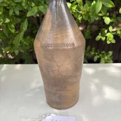 E. HUTCHINSON STONEWARE BOTTLE 10 1/2"