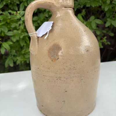 NEW YORK STONEWARE CO., HANDLED JUG WITH COBALT LEAVES
