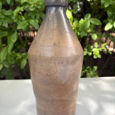 E. HUTCHINSON STONEWARE BOTTLE 10 1/2"