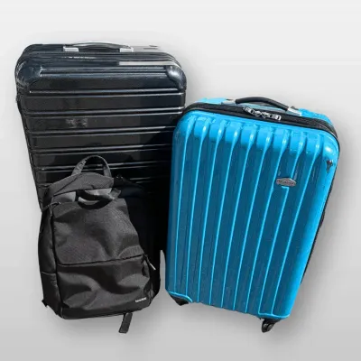 This travel collection features a bright blue Ricardo Beverly Hills hardside spinner suitcase measur
